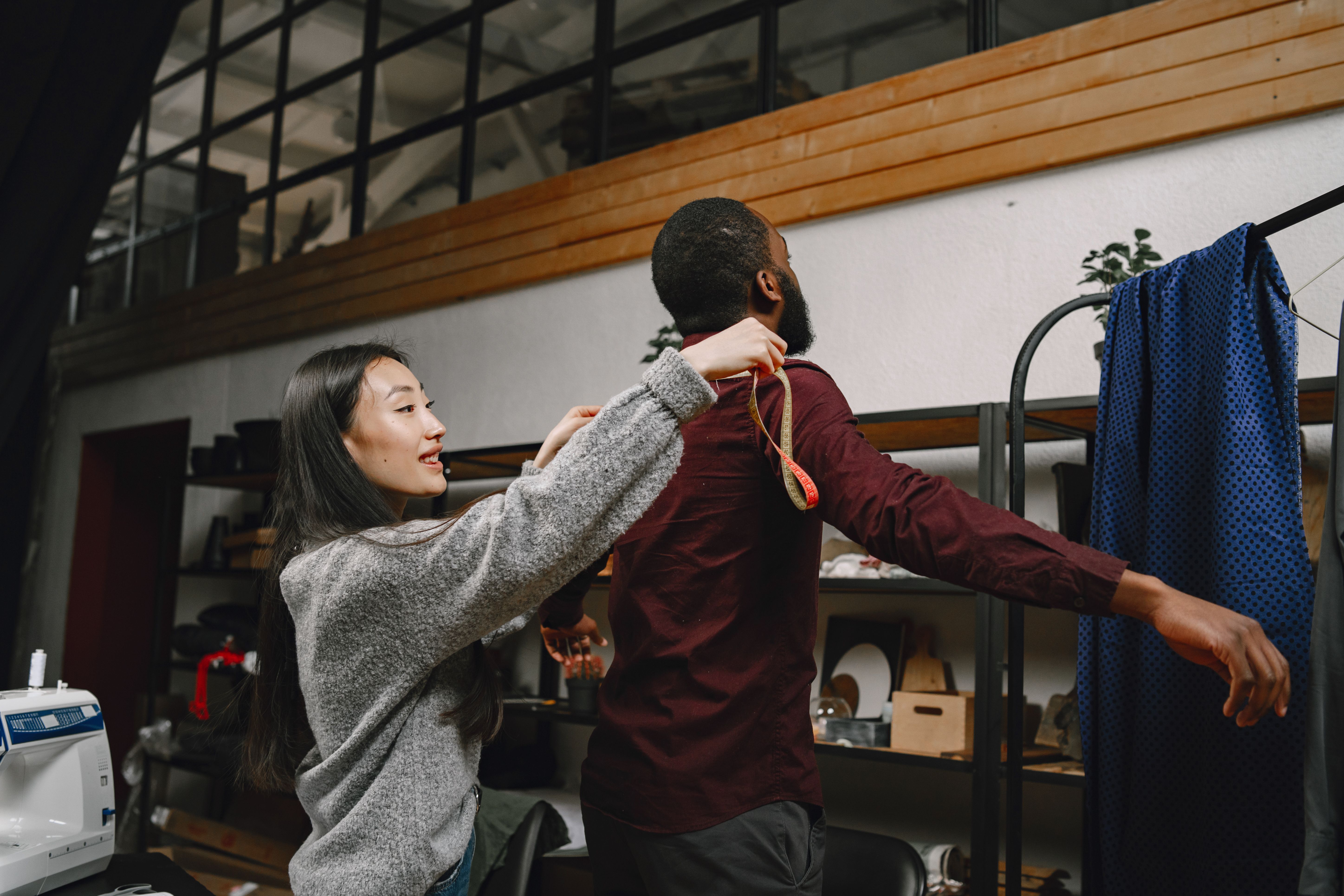 Measuring a henley sleeve with a tailor's tape