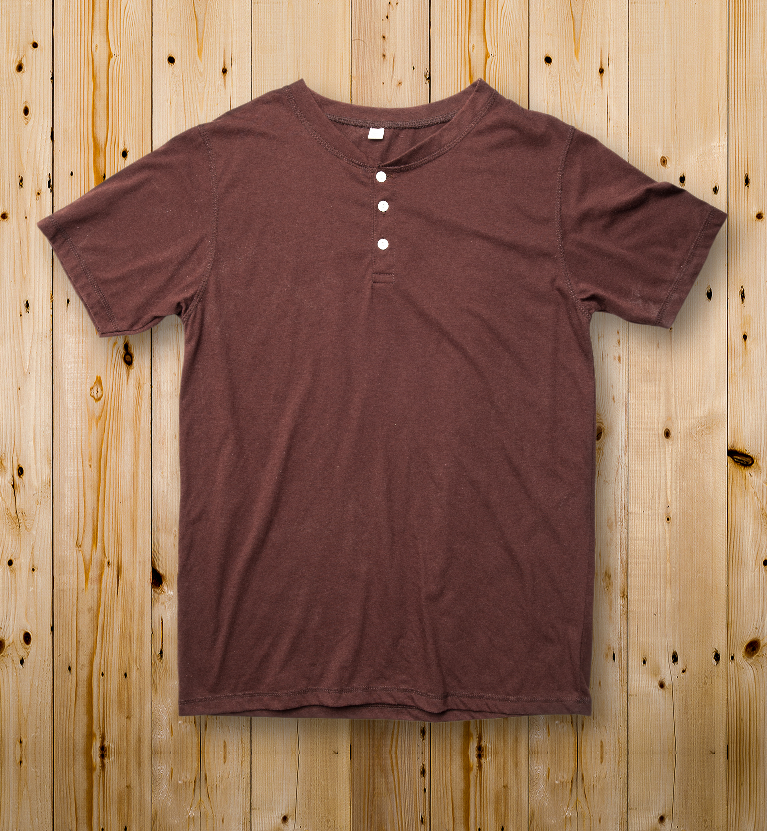Henley shirt laid flat on a table, seen from above