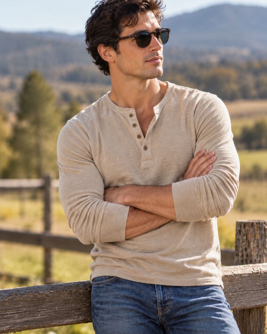 Man in a henley and glasses in the countryside