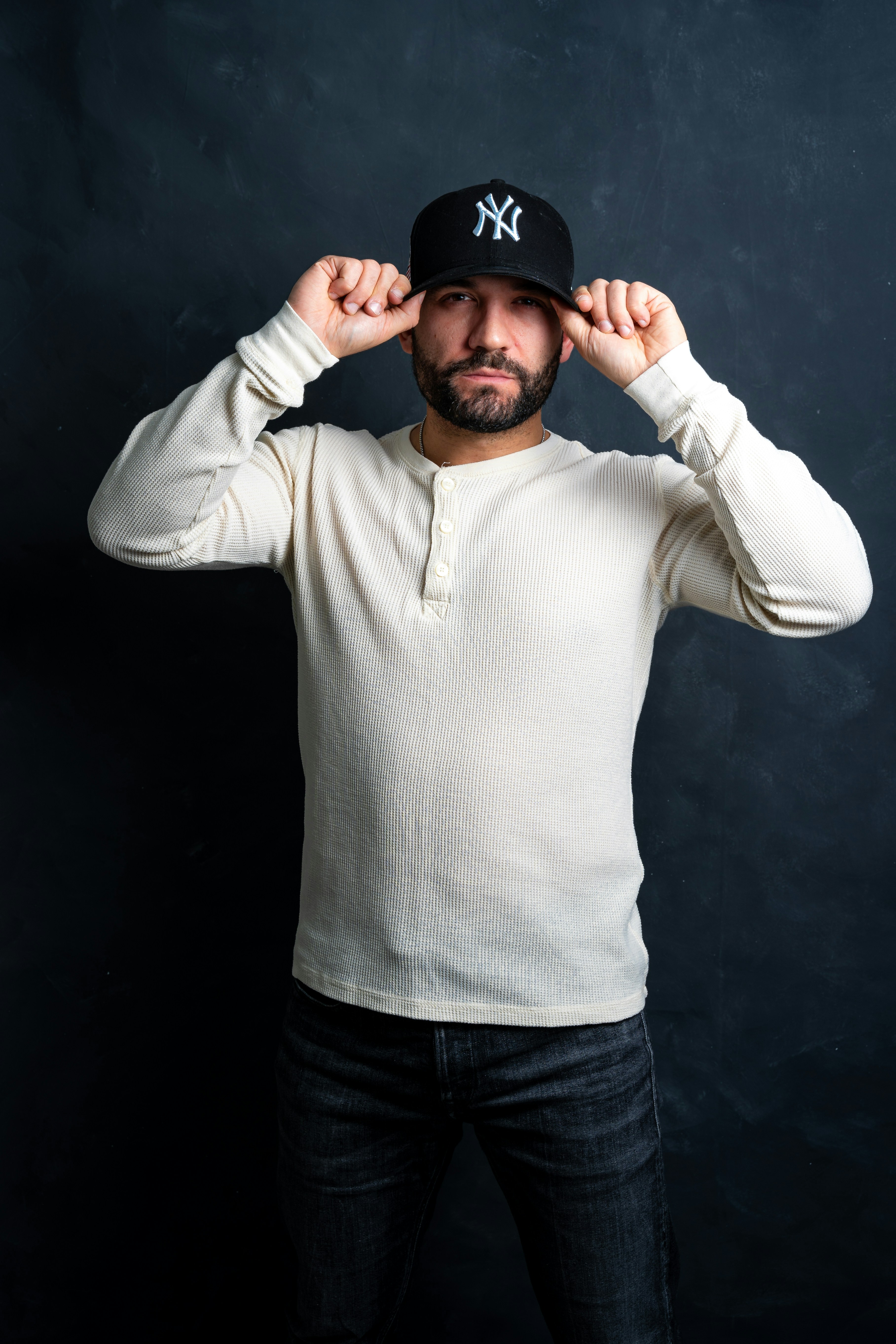 Man in a long sleeve henley, studio portrait